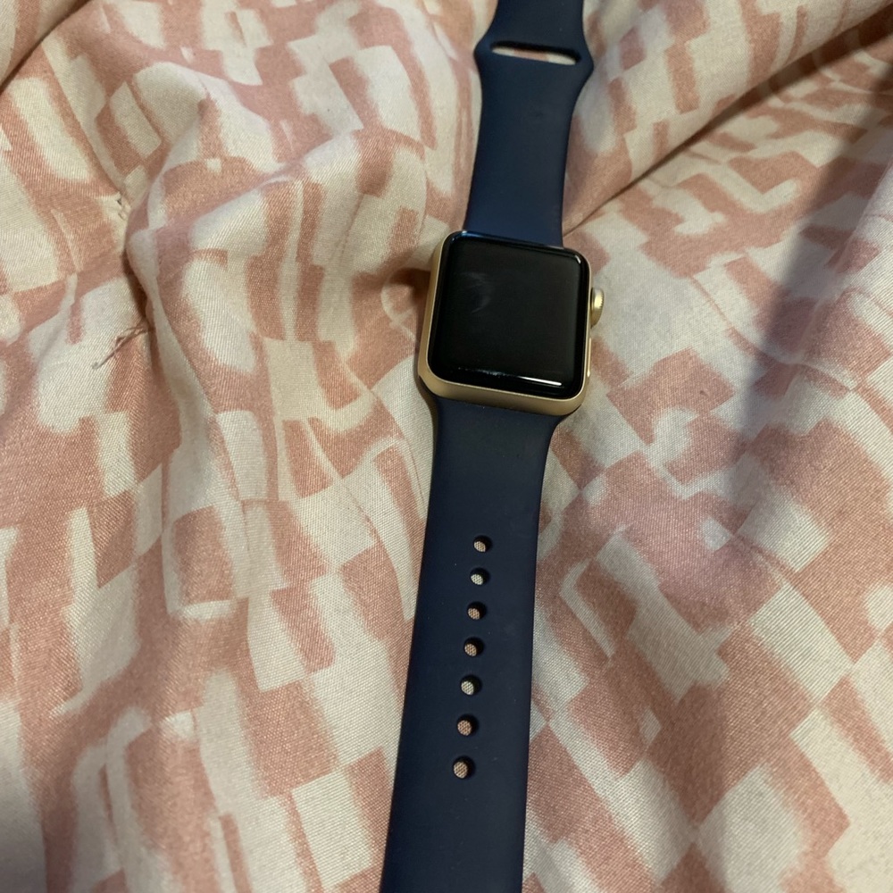Apple Watch 38MM. Gold trim with blue straps